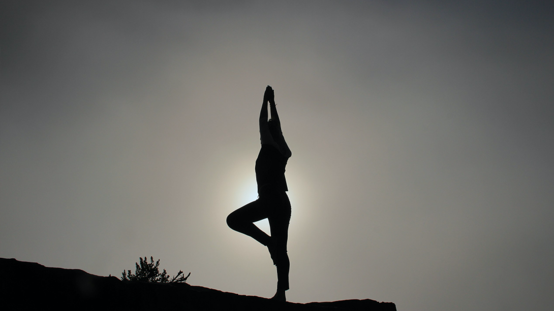 silhouette of figure stretching